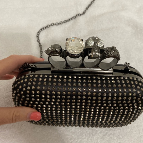 Skull Ring Knuckle Clutch with Chain Strap
McQueen inspired studded design - Picture 5 of 10